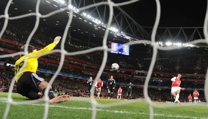 Framed Print : Robin van Persie shoots past Partizan goalkeeper Vladimir Stojkovic to score the 1st Arsenal goal Framed Print : Robin van Persie shoots past Partizan goalkeeper Vladimir Stojkovic to score the 1st Arsenal goal