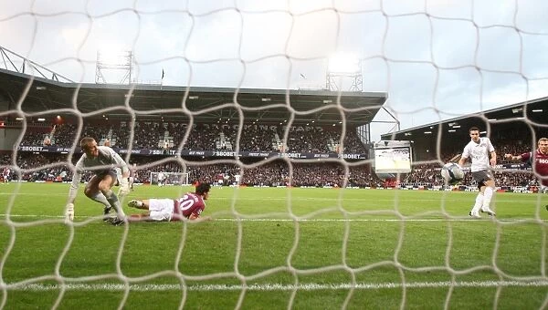 Robin van Persie shoots past West Ham goalkeeper Robert