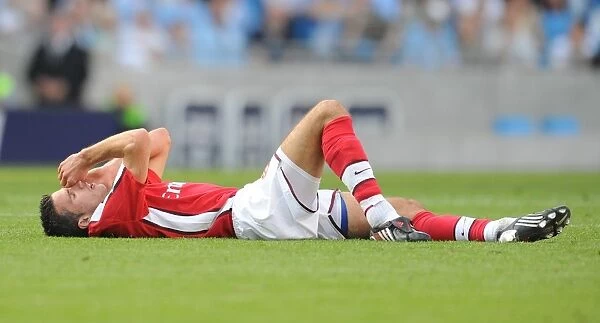 Robin van Persie's Injury: Manchester City's Adebayor Kicks Arsenal Star in Headed Clash