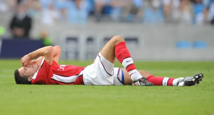 Framed Print : Robin van Persie's Injury: Manchester City's Adebayor Kicks Arsenal Star in Headed Clash Framed Print : Robin van Persie's Injury: Manchester City's Adebayor Kicks Arsenal Star in Headed Clash