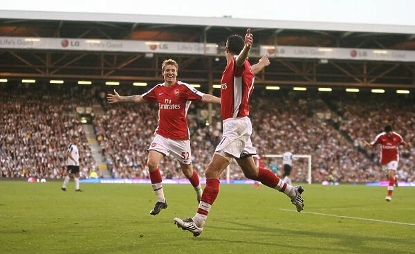 Robin van Persie's Thrilling Goal Celebration with Nicklas Bendtner: Arsenal's 1-0 Victory over Fulham in the Premier League