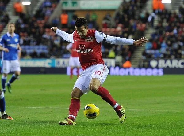 Robin van Persie's Trickery: Arsenal's Star Forward Dazzles Wigan Athletic in Premier League Clash, 2011-12