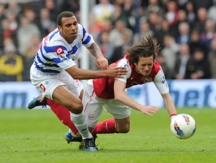 Framed Print : Rosicky vs. Ferdinand: Intense Clash in Queens Park Rangers vs. Arsenal Premier League Match Framed Print : Rosicky vs. Ferdinand: Intense Clash in Queens Park Rangers vs. Arsenal Premier League Match