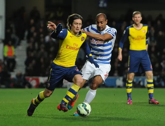 Framed Print : Rosicky vs. Henry: Intense Battle in Queens Park Rangers vs. Arsenal Premier League Clash