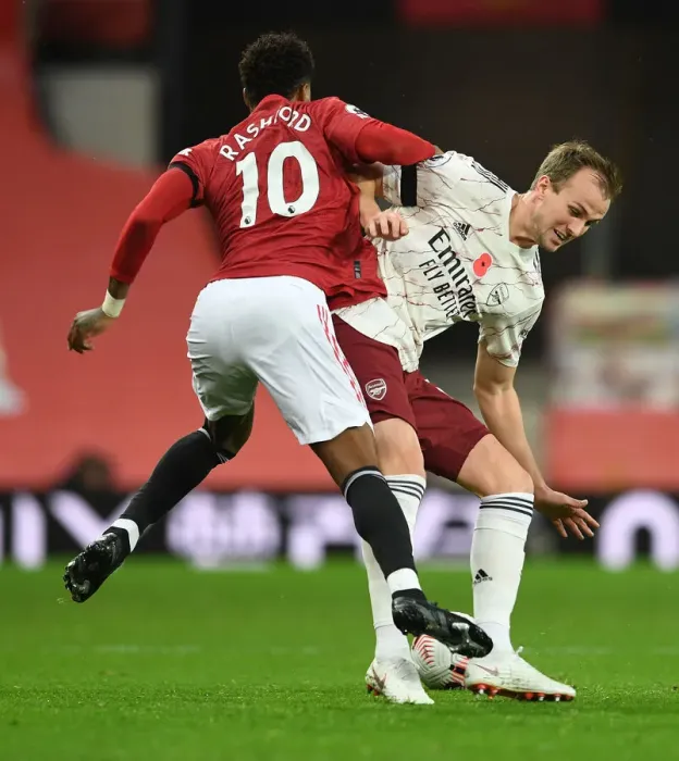 Framed Print : Rousing Rivalry: Holding vs. Rashford - A Premier League Battle at Empty Old Trafford (Manchester United vs. Arsenal, 2020-21)