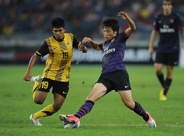 Ryo Miyaichi vs Ahmad Shakir Md Ali: Clash in the 2012-13 Malaysia XI vs Arsenal Match