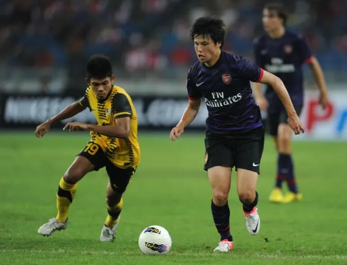 Framed Print : Ryo Miyaichi vs Ahmad Shakir Md Ali: A Football Showdown in the 2012-13 Arsenal Pre-Season Match in Malaysia Framed Print : Ryo Miyaichi vs Ahmad Shakir Md Ali: A Football Showdown in the 2012-13 Arsenal Pre-Season Match in Malaysia