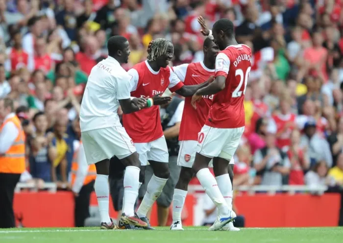 Framed Print : Sagna, Eboue, and Djourou: Arsenal's Unforgettable Celebration of a Pre-Season Double Strike Against Celtic (2010)