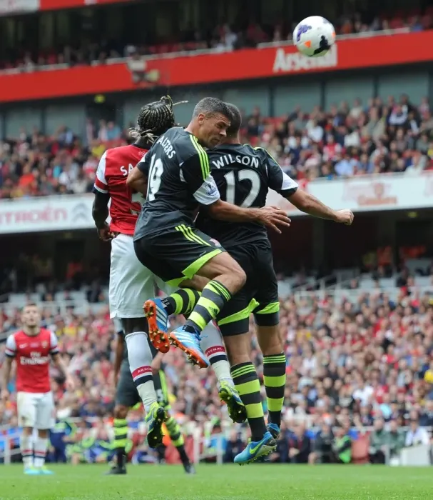 Framed Print : Sagna Scores Third Goal for Arsenal Against Stoke Amidst Pressure from Walters and Wilson