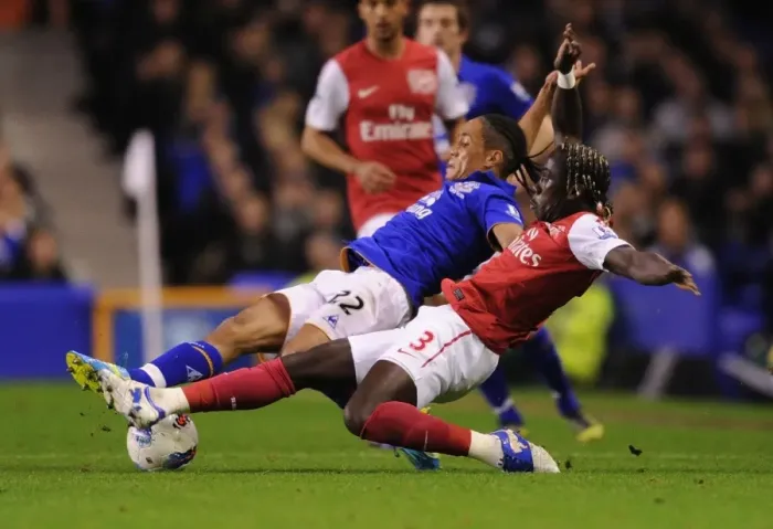 Framed Print : Sagna Stops Pienaar: Intense Battle at Goodison Park - Everton vs Arsenal, Premier League 2011-12 Framed Print : Sagna Stops Pienaar: Intense Battle at Goodison Park - Everton vs Arsenal, Premier League 2011-12