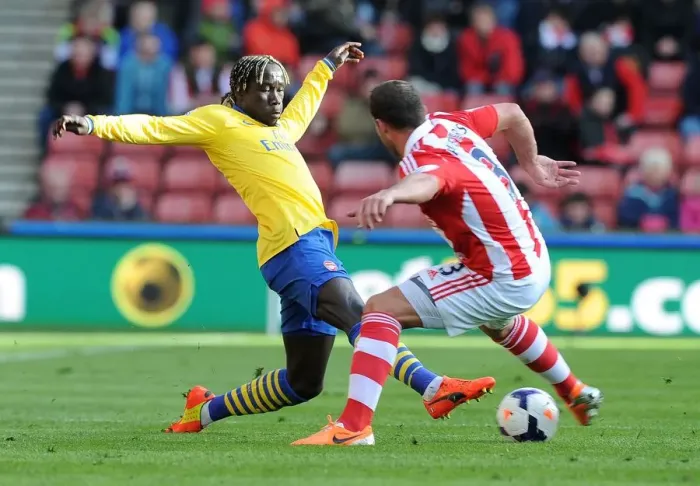 Framed Print : Sagna vs Pieters: Intense Tackle in Stoke City vs Arsenal Premier League Clash Framed Print : Sagna vs Pieters: Intense Tackle in Stoke City vs Arsenal Premier League Clash