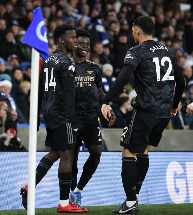 Framed Print : Saka, Nketiah, and Saliba: Arsenal's Triple Threat Celebrates First Goal in Brighton Victory (Brighton & Hove Albion vs Arsenal, 2022-23 Premier League)