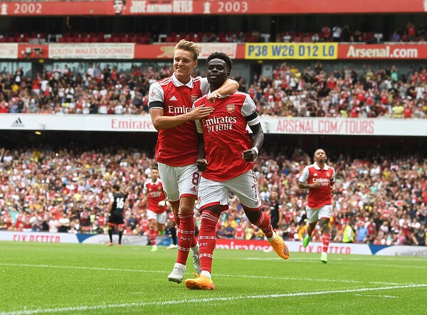 Saka and Odegaard Celebrate First Goal: Arsenal's Emirates Cup Victory, 2022