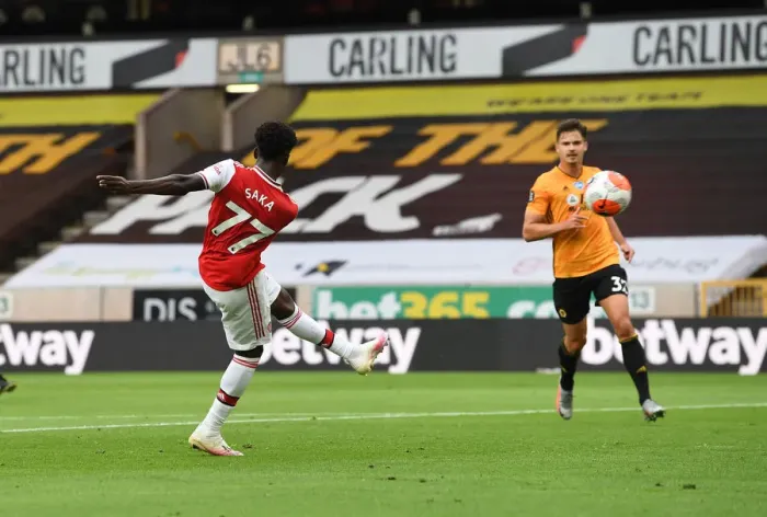 Framed Print : Saka Scores: Arsenal Triumph Over Wolverhampton Wanderers in Premier League Clash (2019-20)