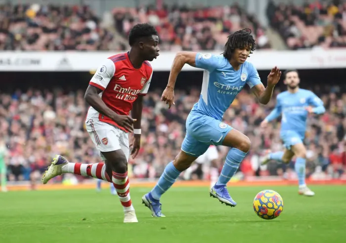 Framed Print : Saka Scores Spectacular Goal: Arsenal's Star Outwits Manchester City's Ake in Epic Premier League Clash Framed Print : Saka Scores Spectacular Goal: Arsenal's Star Outwits Manchester City's Ake in Epic Premier League Clash