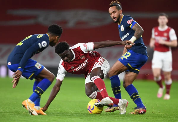 Saka Soars Past Walcott: Arsenal's Young Star Outshines Former Winger in Premier League Victory over Southampton, 2020-21