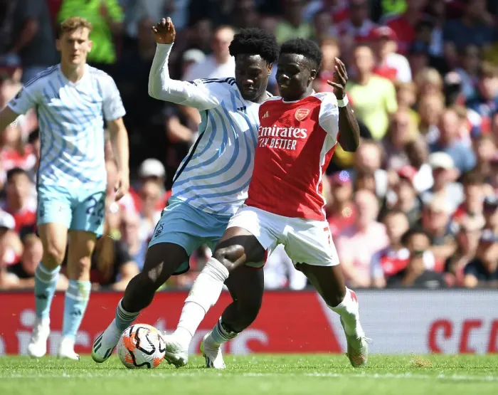 Framed Print : Saka vs. Aina: Clash of Wings in Arsenal's 2023-24 Premier League Battle Framed Print : Saka vs. Aina: Clash of Wings in Arsenal's 2023-24 Premier League Battle