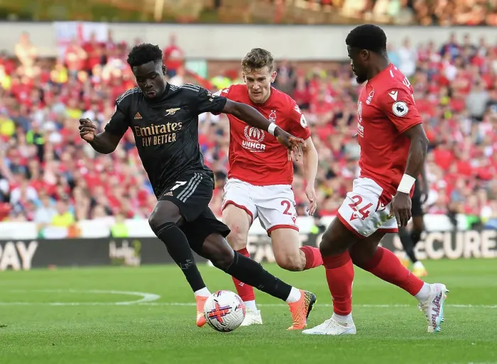 Framed Print : Saka vs Aurier: Battle at the City Ground - Arsenal's Premier League Victory over Nottingham Forest Framed Print : Saka vs Aurier: Battle at the City Ground - Arsenal's Premier League Victory over Nottingham Forest