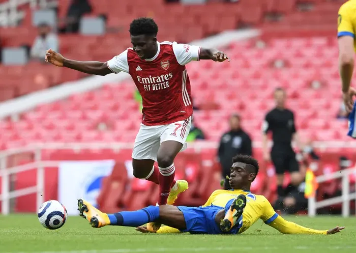 Framed Print : Saka vs Bissouma: A Premier League Showdown at Emirates Stadium