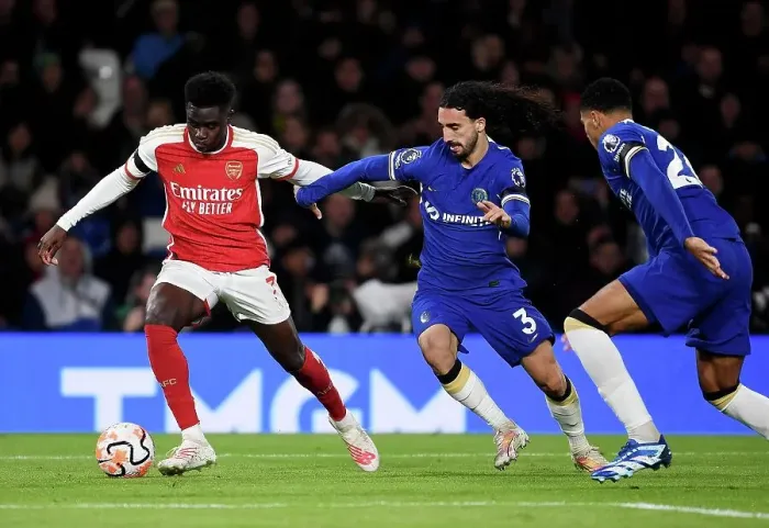 Framed Print : Saka vs. Cucurella: A Premier League Battle at Stamford Bridge (2023-24)