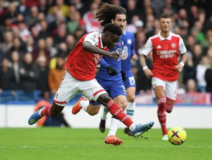Framed Print : Saka vs. Cucurella: A Premier League Showdown at Stamford Bridge Framed Print : Saka vs. Cucurella: A Premier League Showdown at Stamford Bridge