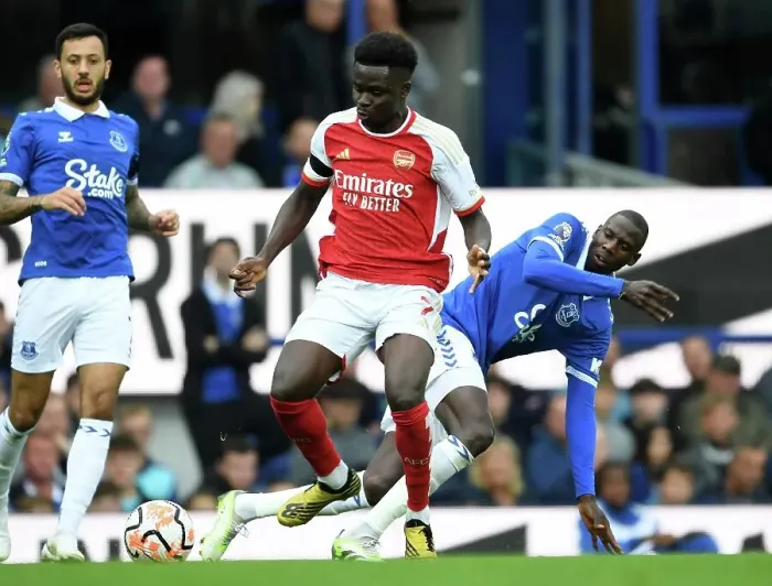 Framed Print : Saka vs Doucoure: A Premier League Battle at Goodison Park Framed Print : Saka vs Doucoure: A Premier League Battle at Goodison Park
