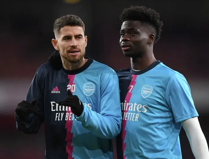 Framed Print : Saka vs. Jorginho: A Premier League Showdown - Arsenal's Young Star Clashes with Manchester City's Midfield Maestro
