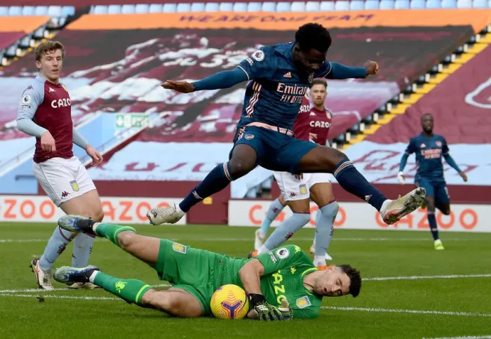 Framed Print : Saka vs Martinez: A Footballing Battle in the Aston Villa vs Arsenal Premier League Clash
