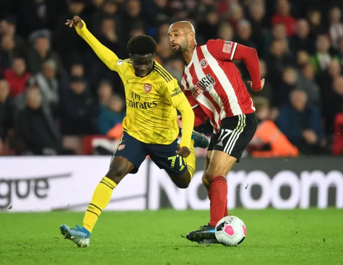 Framed Print : Saka vs. McGoldrick: A Premier League Showdown - Sheffield United vs. Arsenal