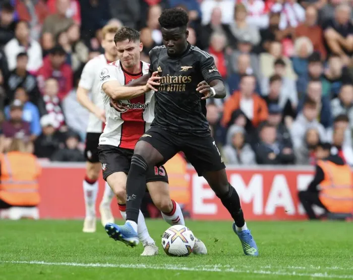 Framed Print : Saka vs Perraud: Battle at St. Mary's - Southampton vs Arsenal, 2022-23 Premier League