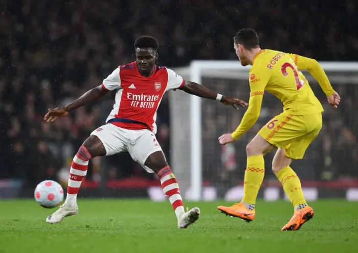 Framed Print : Saka vs. Robertson: A Premier League Showdown at Emirates - Arsenal vs. Liverpool