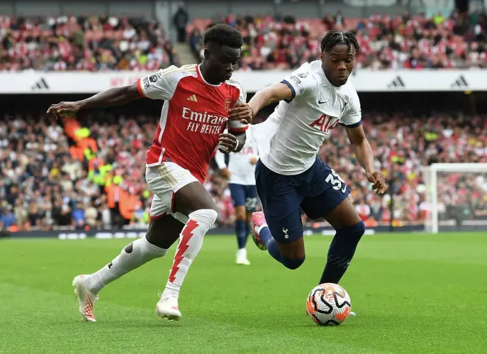 Framed Print : Saka vs. Udogie: Intense Rivalry Unfolds - Arsenal's Bukayo Saka Clashes with Tottenham's Destiny Udogie in the 2023-24 Premier League Showdown at Emirates Stadium Framed Print : Saka vs. Udogie: Intense Rivalry Unfolds - Arsenal's Bukayo Saka Clashes with Tottenham's Destiny Udogie in the 2023-24 Premier League Showdown at Emirates Stadium
