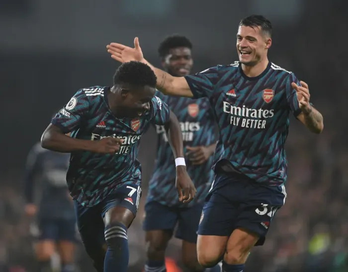 Framed Print : Saka and Xhaka Celebrate Arsenal's Victory over Norwich City in the Premier League