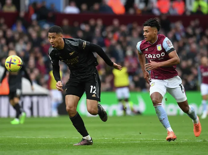 Framed Print : Saliba Chased Down by Watkins: Aston Villa vs. Arsenal, Premier League 2022-23