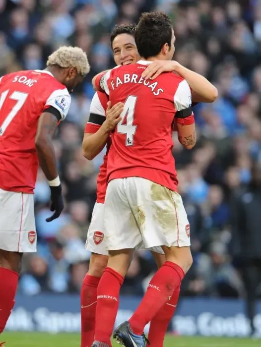 Framed Print : Sami Nasri and Cesc Fabregas celebrate the 2nd Arsenal goal, scored by Alex Song