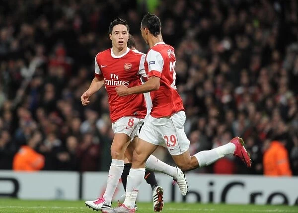 Sami Nasri and Marouane Chamakh: Celebrating Arsenal's 5-1 Victory Over Shakhtar Donetsk in the Champions League