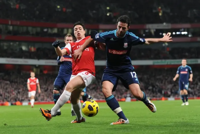 Framed Print : Samir Nasri (Arsenal) Marc Wilson (Stoke). Arsenal 1: 0 Stoke City. Barclays Premier League Framed Print : Samir Nasri (Arsenal) Marc Wilson (Stoke). Arsenal 1: 0 Stoke City. Barclays Premier League