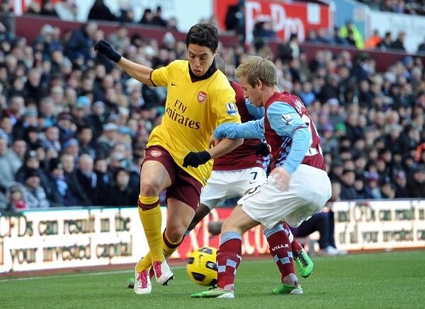 Samir Nasri (Arsenal) nutmegs Barry Bannan (Villa). Aston Villa 2: 4 Arsenal