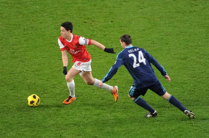 Framed Print : Samir Nasri (Arsenal) Rory Delap (Stoke). Arsenal 1: 0 Stoke City. Barclays Premier League Framed Print : Samir Nasri (Arsenal) Rory Delap (Stoke). Arsenal 1: 0 Stoke City. Barclays Premier League