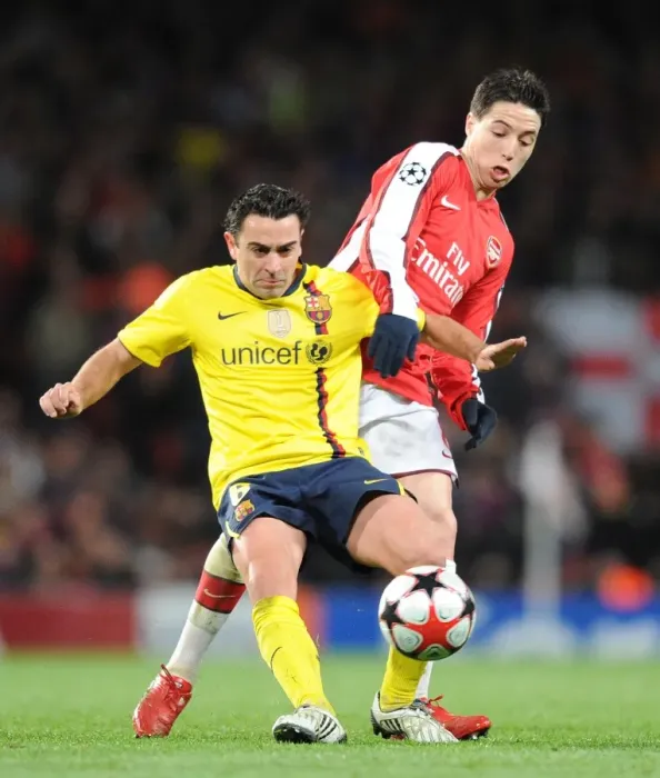 Framed Print : Samir Nasri (Arsenal) Xavi (Barcelona). Arsenal 2: 2 Barcelona, UEFA Champions League