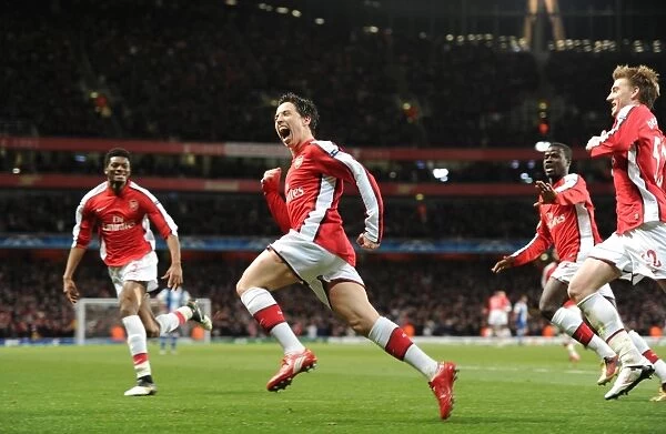 Samir Nasri celebrates scoring the 3rd Arsenal goal with Nicklas Bendtner