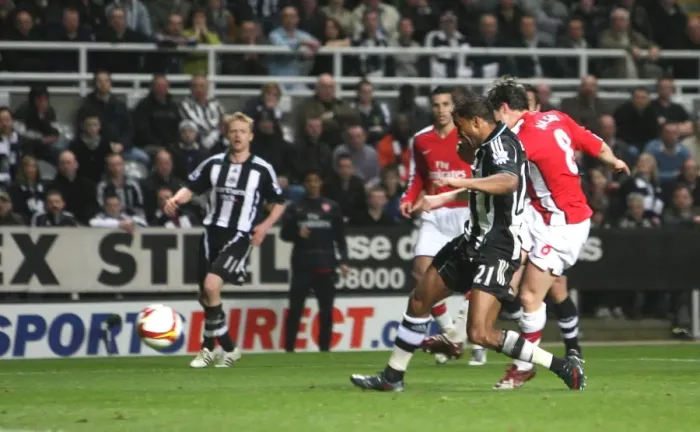 Framed Print : Samir Nasri shoots past Newcastle goalkeeper Steve Framed Print : Samir Nasri shoots past Newcastle goalkeeper Steve