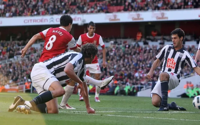 Framed Print : Sammir Nasri scores Arsenals 1st goal past Pablo Ibanez (WBA). Arsenal 2 Framed Print : Sammir Nasri scores Arsenals 1st goal past Pablo Ibanez (WBA). Arsenal 2