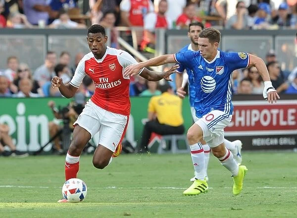 SAN JOSE, CA - JULY 28: Jeff Reine-Adelaide of Arsenal takes on Wil Trapp of the MLS Allstars during the match between