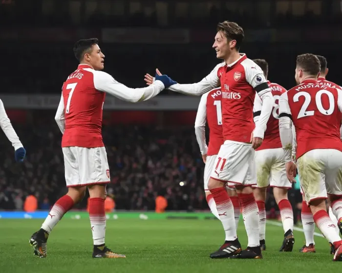 Framed Print : Sanchez and Ozil Celebrate Arsenal's Goals Against Huddersfield Town (2017-18)