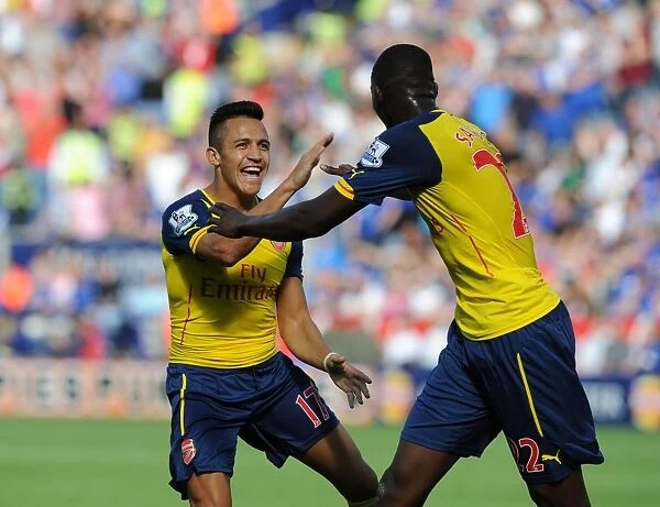 Sanchez and Sanogo: Arsenal's Unstoppable Duo Celebrates Goal Against Leicester City (2014-15)