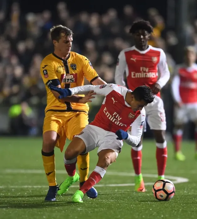 Framed Print : Sanchez vs. Collins: Arsenal's FA Cup Fifth Round Battle at Sutton United Framed Print : Sanchez vs. Collins: Arsenal's FA Cup Fifth Round Battle at Sutton United