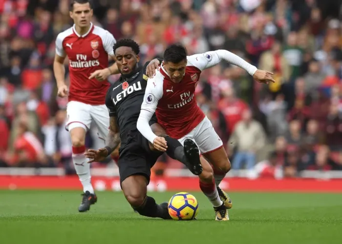 Framed Print : Sanchez vs. Fer: A Football Showdown at Emirates Stadium