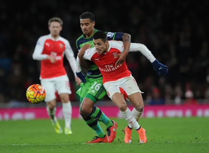Framed Print : Sanchez vs. Naughton: A Battle of Wits in Arsenal's Triumph over Swansea City