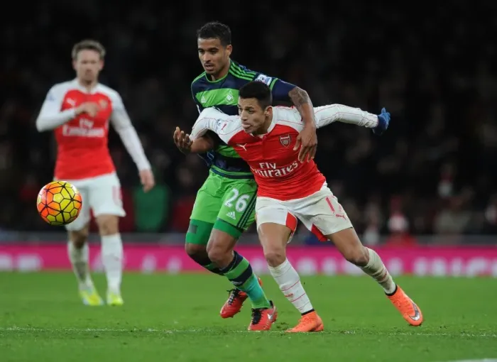 Framed Print : Sanchez vs. Naughton: Intense Clash in Arsenal's Victory over Swansea City Framed Print : Sanchez vs. Naughton: Intense Clash in Arsenal's Victory over Swansea City